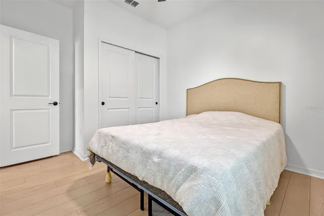 a large white bed in a white room