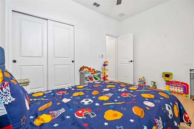 a bedroom with bed and curtain