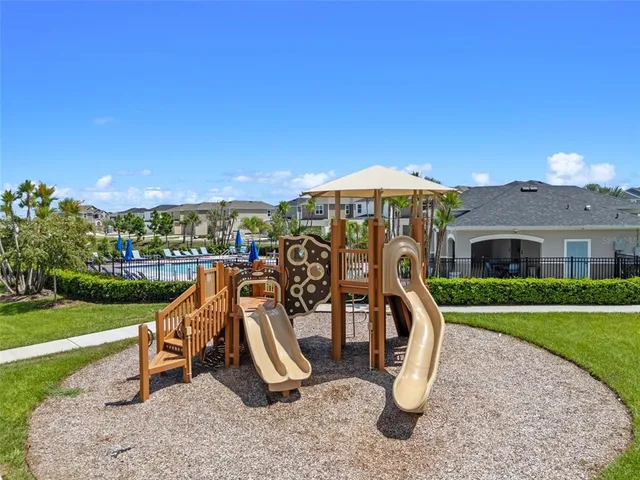a view of a house with garden and ocean view