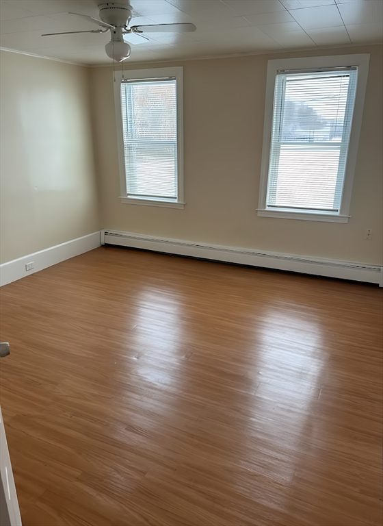 10 March Street, Unit B Worcester, MA 01604 - Photo 2 of 4 an empty room with wooden floor and windows