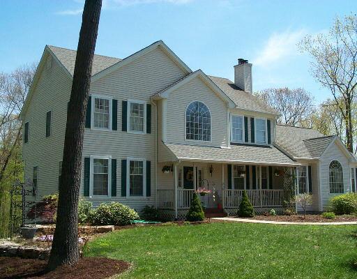 81 Marlin Road Newtown, CT 06482 - Photo 1 of 1 a front view of a house with a yard and garage