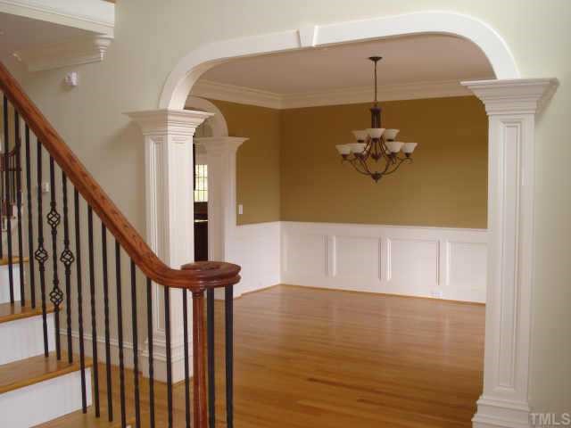 7611 Devere Court Raleigh, NC 27613 - Photo 6 of 12 FOYER AND DINING ROOM*NOTE THE ARCHES AND THE TRIM W/ ARCHED OPENINGS