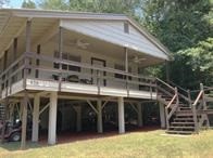 496 Campground Road Trinity, TX 75862 - Photo 1 of 22 a view of a house with a balcony