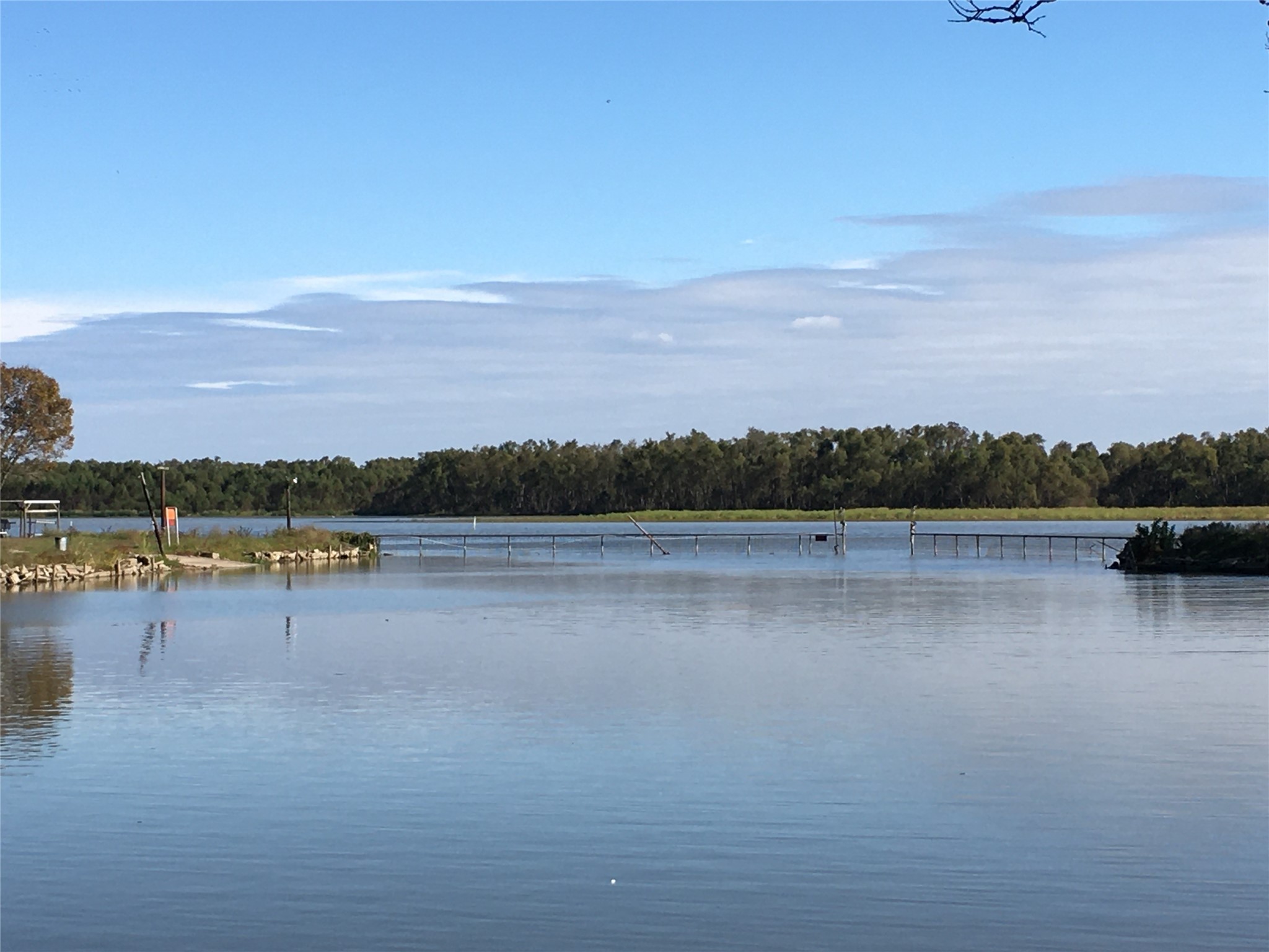 496 Campground Road Trinity, TX 75862 - Photo 20 of 22 a view of lake with boats and trees in the background