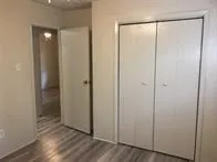 a view of a bathroom with wooden floor