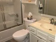 a bathroom with a sink and toilet