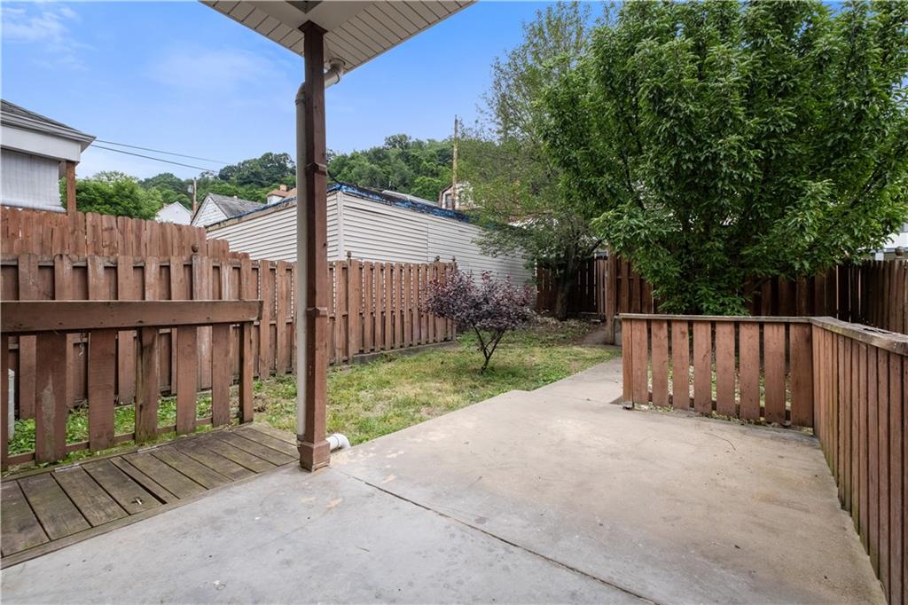 1306 Broadway Avenue McKees Rocks, PA 15136 - Photo 29 of 33 a view of backyard with small cabin and wooden fence