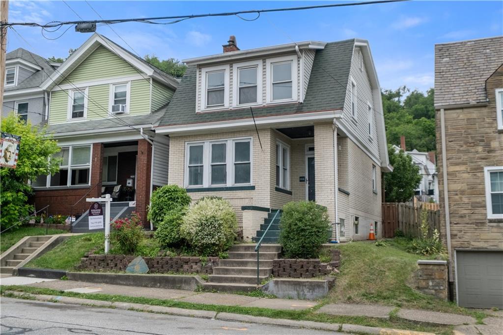 1306 Broadway Avenue McKees Rocks, PA 15136 - Photo 3 of 33 a front view of a house with a yard