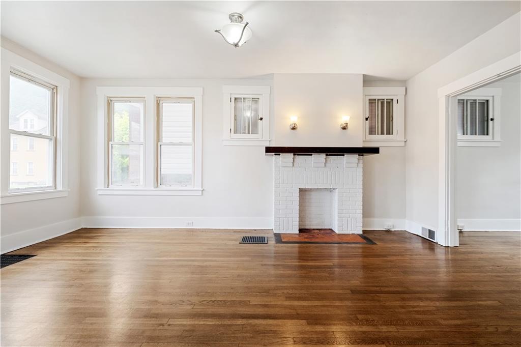 1306 Broadway Avenue McKees Rocks, PA 15136 - Photo 6 of 33 a view of empty room with wooden floor and fan