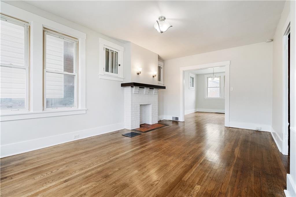 1306 Broadway Avenue McKees Rocks, PA 15136 - Photo 7 of 33 a view of empty room with wooden floor and window