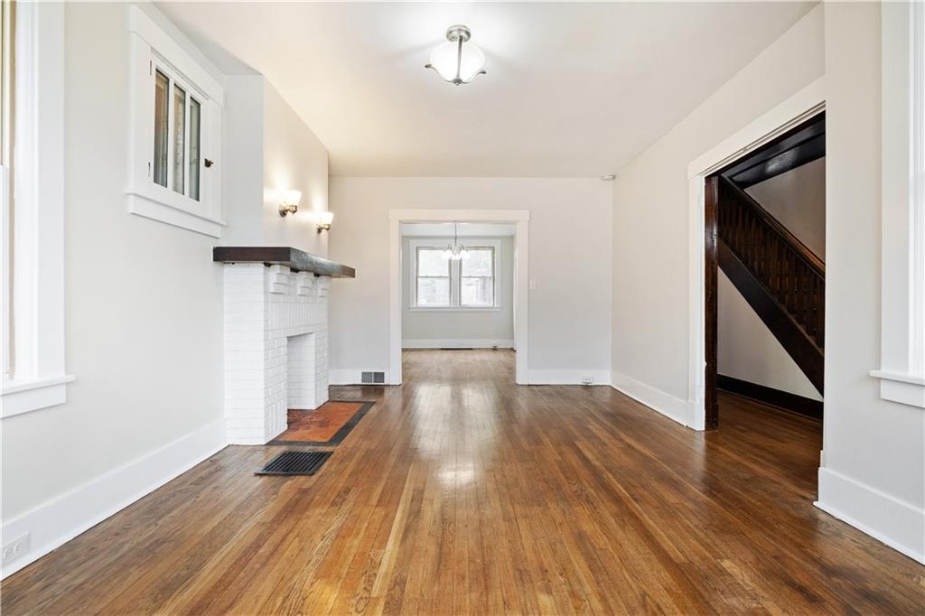 1306 Broadway Avenue McKees Rocks, PA 15136 - Photo 8 of 33 an empty room with wooden floor and windows
