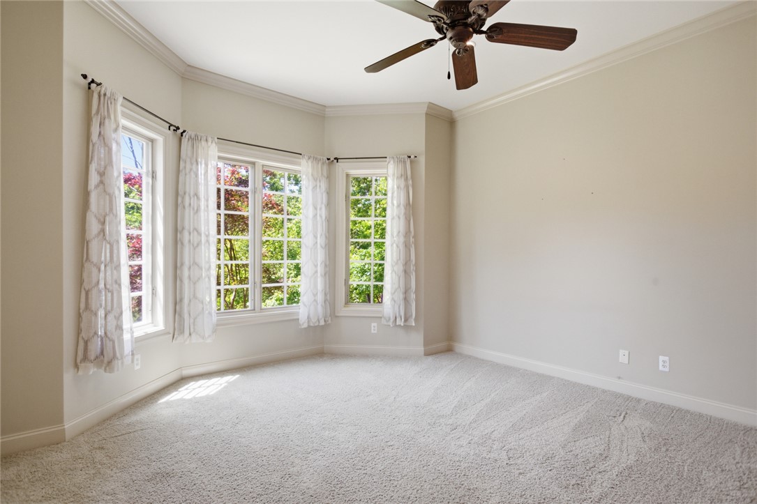 130 River Ridge Road Sunset, SC 29685 - Photo 29 of 47 This airy bedroom features ample natural light from bay windows and comfortable carpeting underfoot.