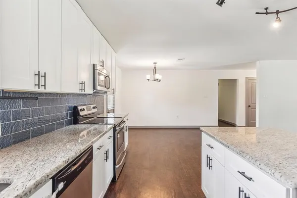a kitchen with a sink and a refrigerator