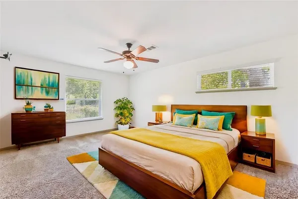 a bedroom with a bed and a couch