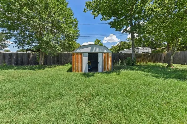 a backyard of a house with lots of green space