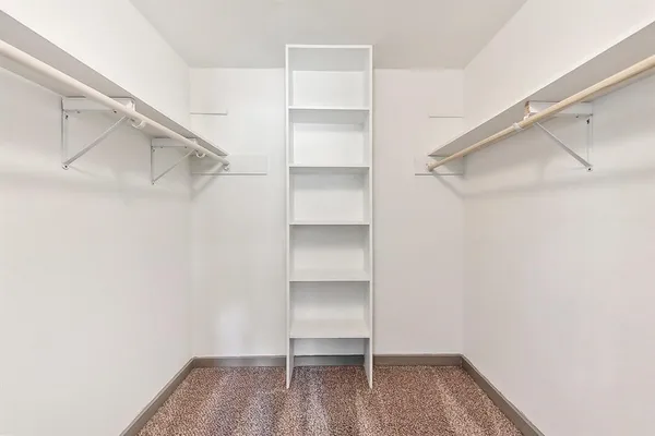 a view of an empty walk in closet