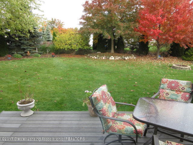 3320 Hidden Ridge Drive Dewitt, MI 48820 - Photo 35 of 38 Lovely deck off kitchen