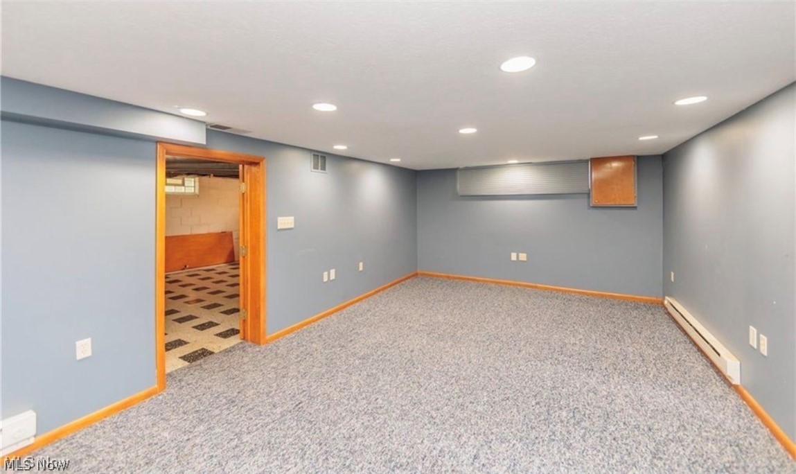 4521 Emerson Road South Euclid, OH 44121 - Photo 37 of 47 Spacious room with recessed lighting and blue-painted walls