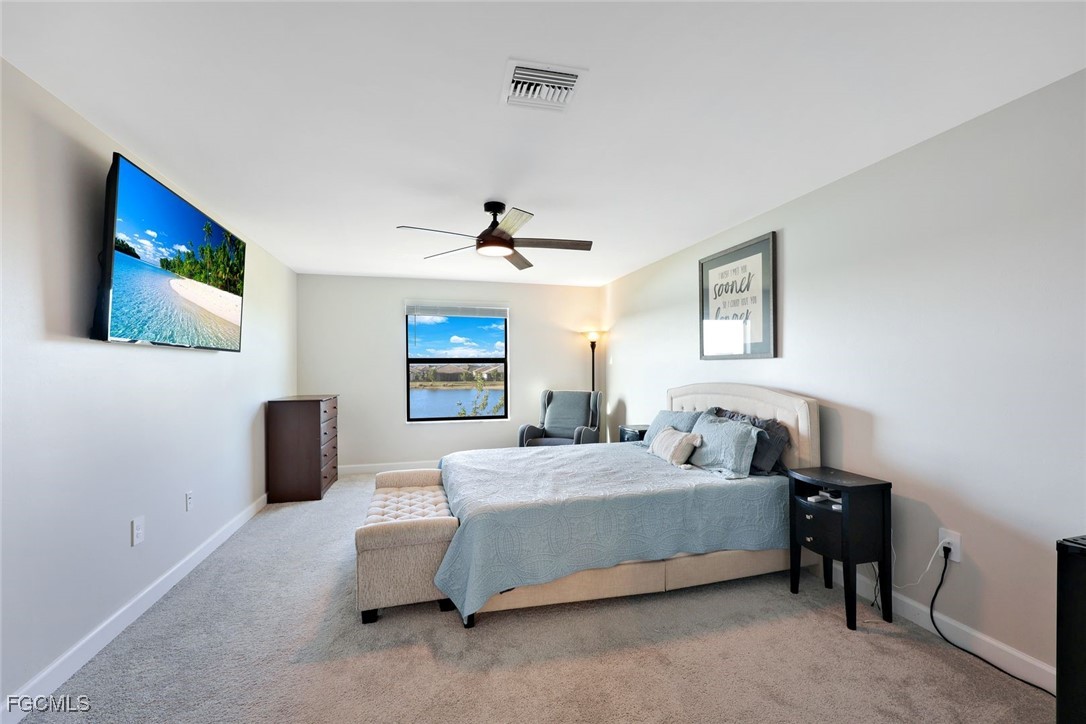 11087 Canopy Loop Fort Myers, FL 33913 - Photo 14 of 48 a bedroom with a bed and a couch