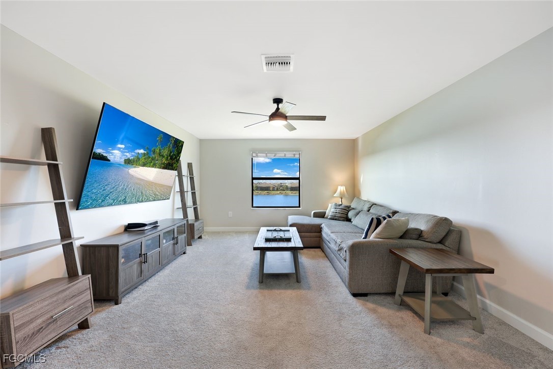 11087 Canopy Loop Fort Myers, FL 33913 - Photo 19 of 48 a living room with furniture and a flat screen tv