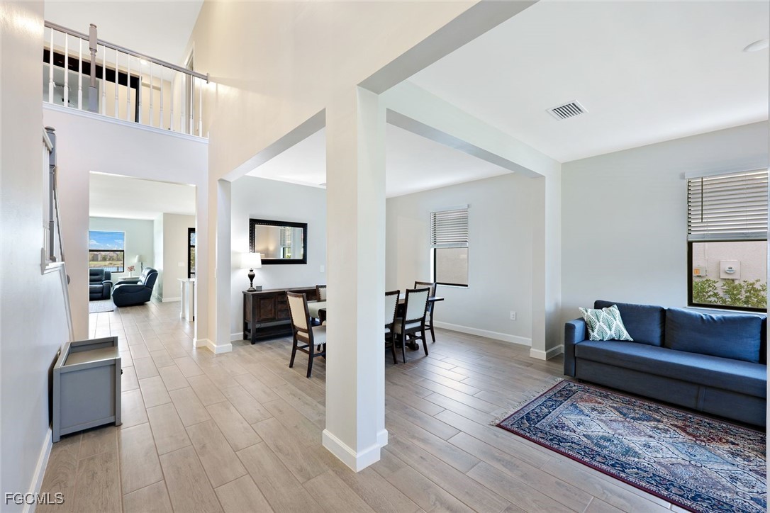 11087 Canopy Loop Fort Myers, FL 33913 - Photo 2 of 48 a living room with furniture and a wooden floor