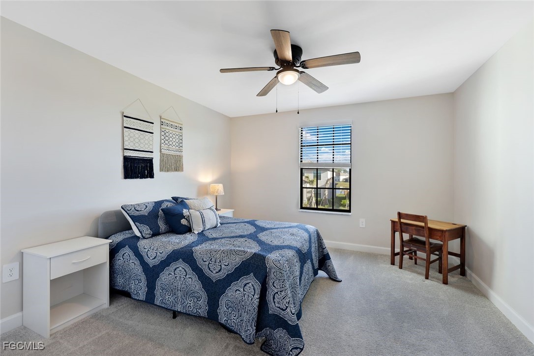11087 Canopy Loop Fort Myers, FL 33913 - Photo 23 of 48 a bedroom with a bed furniture and a window