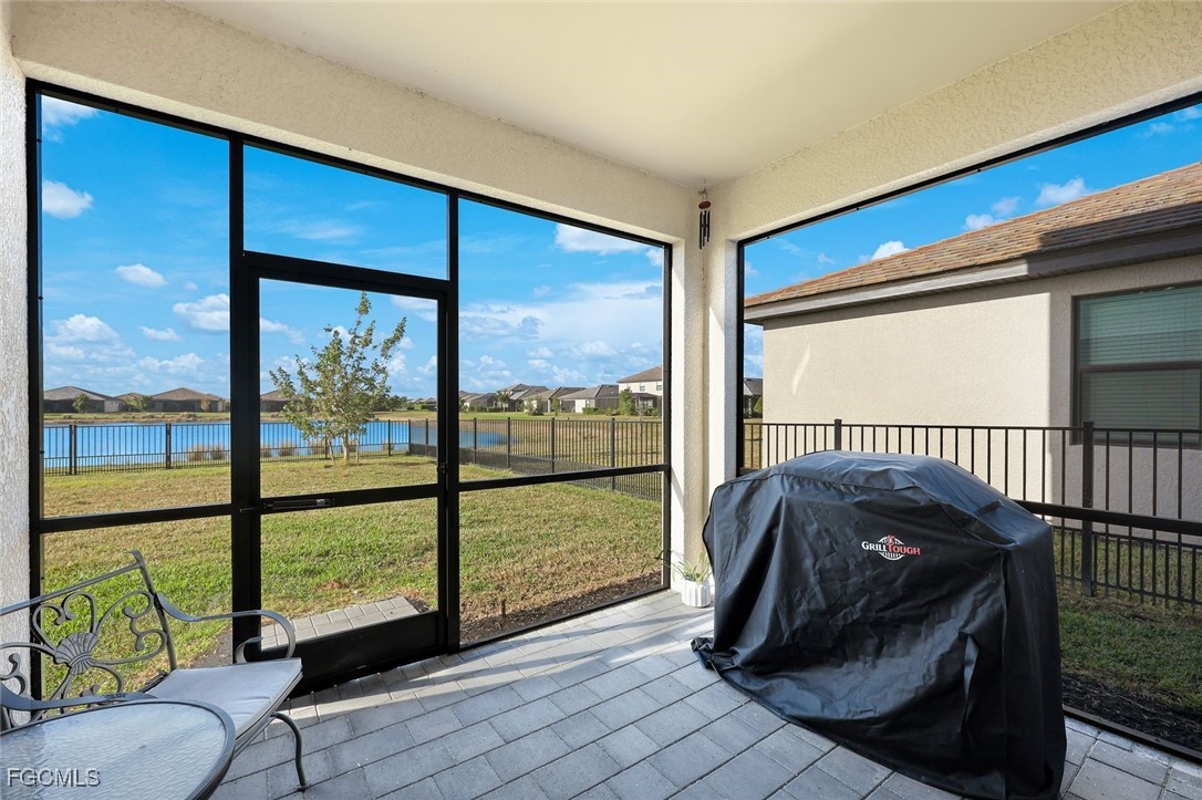11087 Canopy Loop Fort Myers, FL 33913 - Photo 25 of 48 a living room with a large window and a table