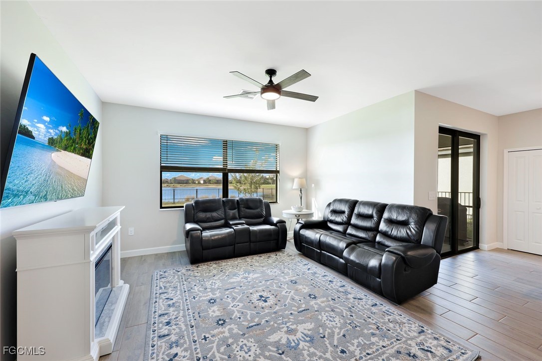 11087 Canopy Loop Fort Myers, FL 33913 - Photo 4 of 48 a living room with furniture and a flat screen tv