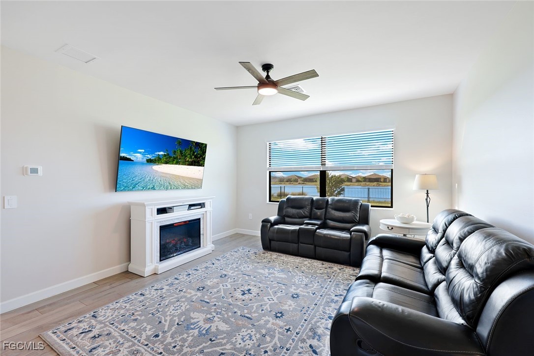 11087 Canopy Loop Fort Myers, FL 33913 - Photo 5 of 48 a living room with furniture and a flat screen tv