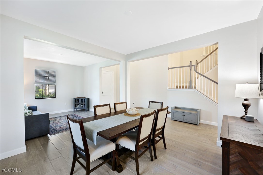 11087 Canopy Loop Fort Myers, FL 33913 - Photo 9 of 48 a view of a dining room with furniture and a livingroom