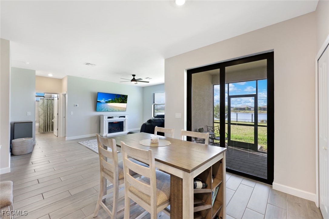 11087 Canopy Loop Fort Myers, FL 33913 - Photo 10 of 48 a open kitchen with a table and chairs