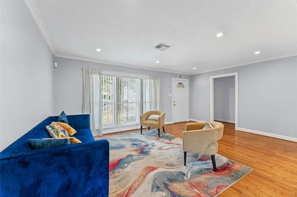 a living room with furniture and a table
