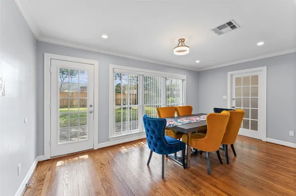 a view of a dining room with furniture window and wooden floor