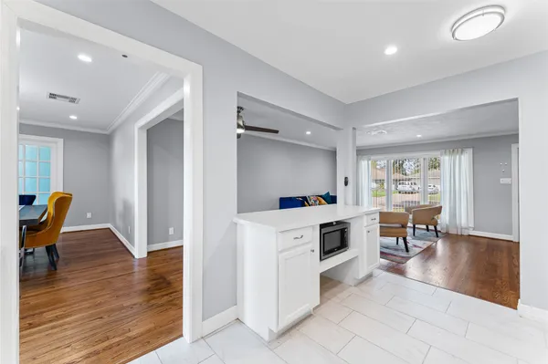 a view of kitchen with furniture and wooden floor