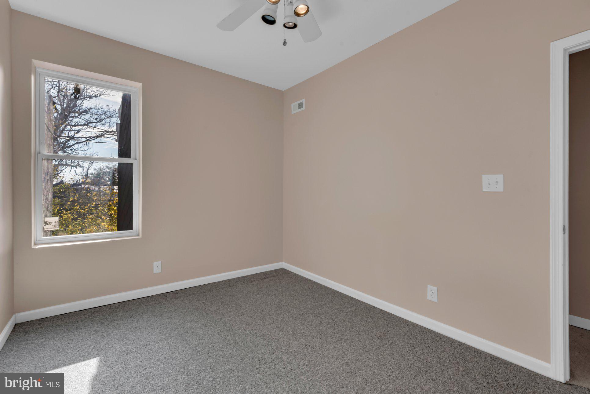 1007 East Preston Street Baltimore, MD 21202 - Photo 27 of 36 an empty room with a window