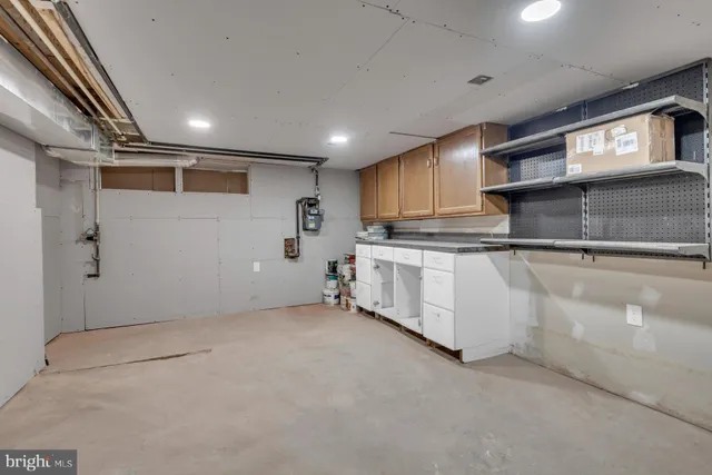 a kitchen with stainless steel appliances granite countertop a refrigerator and a stove