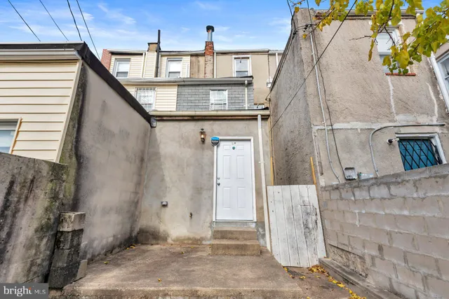 a front view of a house with large windows