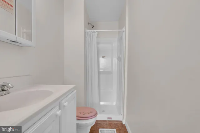 a bathroom with a sink toilet and vanity