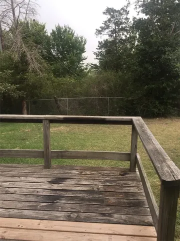 a view of a swimming pool with a yard