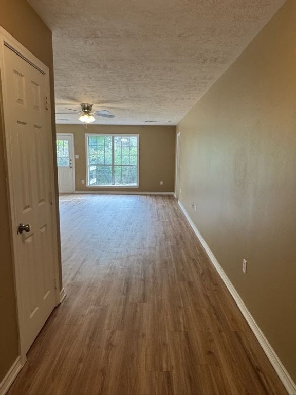 1809 Richmond Avenue Bryan, TX 77802 - Photo 2 of 12 wooden floor in an empty room with a window