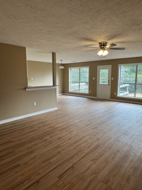 1809 Richmond Avenue Bryan, TX 77802 - Photo 3 of 12 a view of an empty room with window and wooden floor
