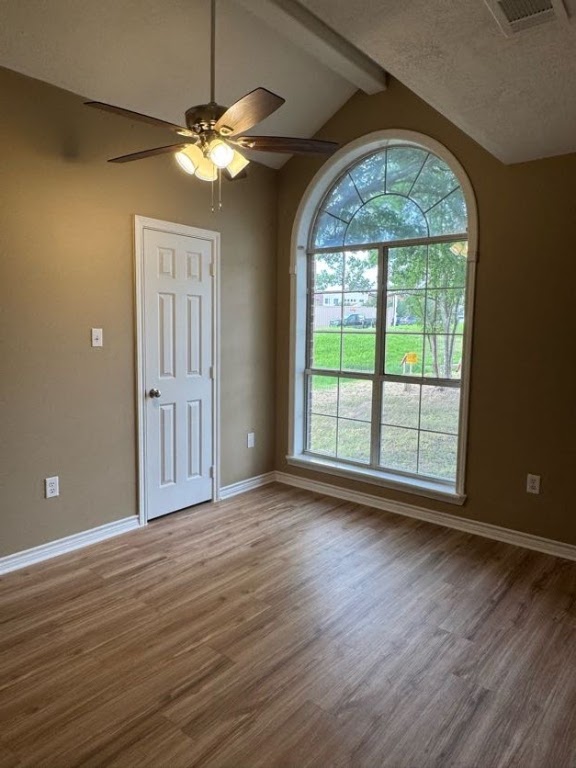 1809 Richmond Avenue Bryan, TX 77802 - Photo 8 of 12 an empty room with wooden floor fan and windows