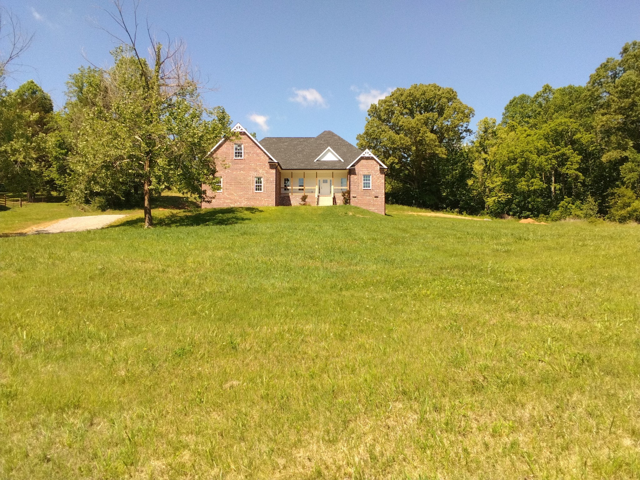 2006 McMahan Hollow Road Pleasant View, TN 37146 - Photo 1 of 20 a front view of house with yard and trees