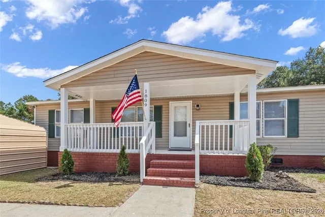 a view of houses with yard
