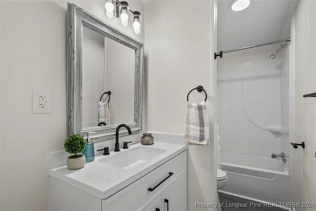 a view of a balcony with wooden floor and fence and a bench