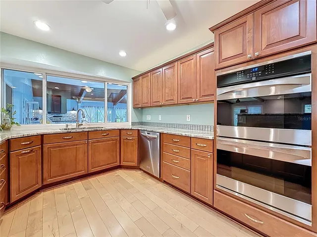 a spacious bathroom with a double vanity sink a mirror and shower