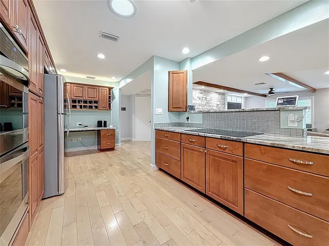 a bathroom with a sink mirror vanity and toilet
