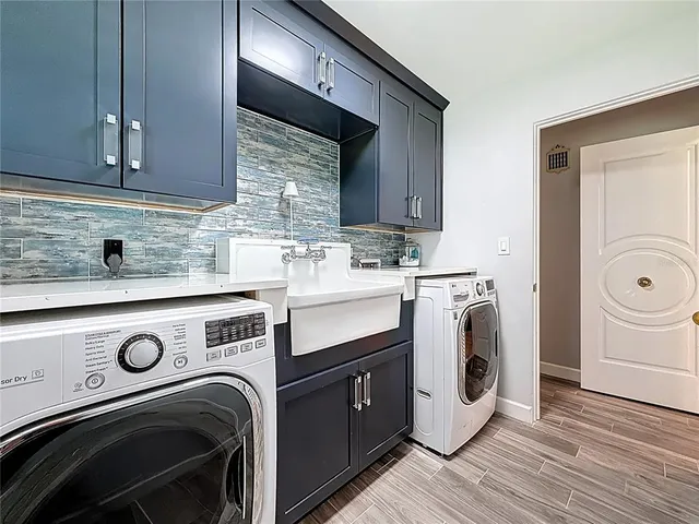 a bathroom with a double vanity sink mirror and