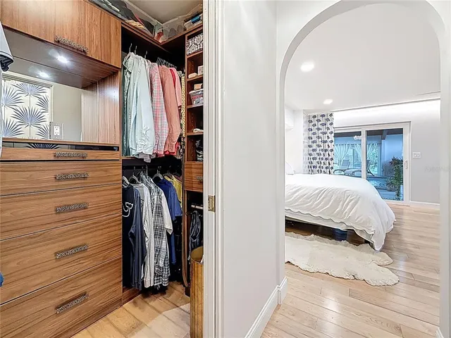 a view of a patio with table and chairs and a barbeque