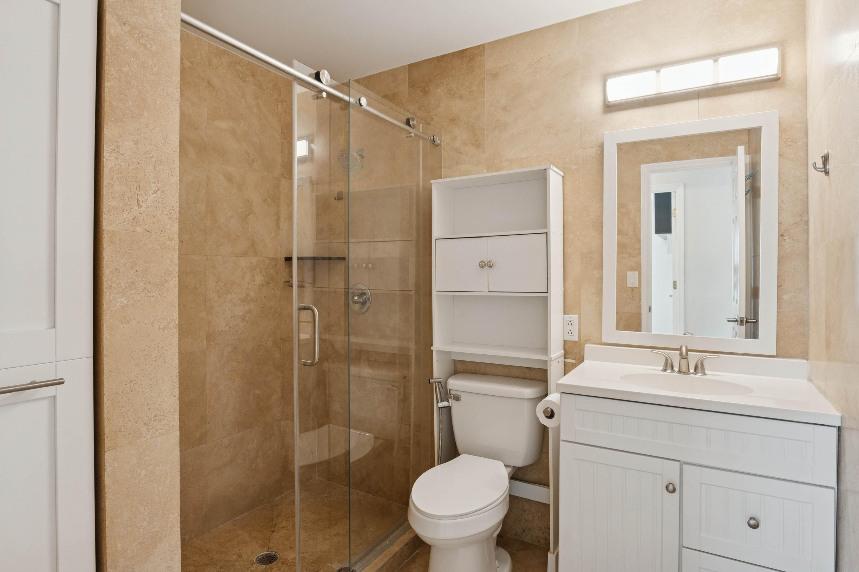 4971 Ataman Street Boca Raton, FL 33428 - Photo 26 of 35 a bathroom with a shower sink vanity and toilet